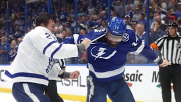 Apr 11, 2023; Tampa, Florida, USA; Tampa Bay Lightning left wing Pat Maroon (14) and Toronto Maple Leafs defenseman Luke Schenn (2) fight during the first period at Amalie Arena. Mandatory Credit: Kim Klement-USA TODAY Sports
