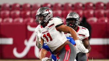 Thompson's Peter Woods (11) runs up to put pressure on the Auburn quarterback. Auburn High and Thompson High faced off in the AHSAA 7A State Championship on Dec. 2 at Bryant-Denny Stadium. [Photo/Hannah Saad]Tus Al Thompsonvsauburn7achampionship 3676