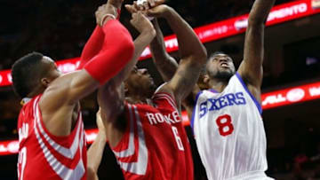 Nov 3, 2014; Philadelphia, PA, USA; Philadelphia 76ers guard Tony Wroten (8) scores past Houston Rockets forward Terrence Jones (6) and center Dwight Howard (12) at the Wells Fargo Center. The Rockets defeated the 76ers 104-93. Mandatory Credit: Bill Streicher-USA TODAY Sports