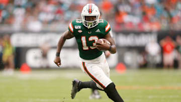 MIAMI, FLORIDA - NOVEMBER 09: DeeJay Dallas #13 of the Miami Hurricanes runs for a touchdown against the Louisville Cardinals during the first half at Hard Rock Stadium on November 09, 2019 in Miami, Florida. (Photo by Michael Reaves/Getty Images)