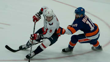UNIONDALE, NY - OCTOBER 04: Washington Capitals Defenseman Dmitry Orlov (9) and New York Islanders Center Derick Brassard (10) battle for the puck during the second period of the game between the Washington Capitals and the New York Islanders on October 4, 2019, at Nassau Veterans Memorial Coliseum in Uniondale, NY> (Photo by Gregory Fisher/Icon Sportswire via Getty Images)