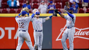 CINCINNATI, OH - AUGUST 22: Kyle Schwarber #12, Ian Happ #8 and Jason Heyward #22 of the Chicago Cubs celebrate after the final out of the13-9 win against the Cincinnati Reds at Great American Ball Park on August 22, 2017 in Cincinnati, Ohio. (Photo by Andy Lyons/Getty Images)