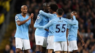 MANCHESTER, ENGLAND - MAY 09: Yaya Toure of Manchester City is embrace by Vincent Kompany of Manchester City , Leroy Sane of Manchester City, Fernandinho of Manchester City and Brahim Diaz of Manchester City as he is subbed during the Premier League match between Manchester City and Brighton and Hove Albion at Etihad Stadium on May 9, 2018 in Manchester, England. (Photo by Gareth Copley/Getty Images)