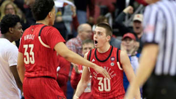 LOUISVILLE, KENTUCKY - FEBRUARY 23: Ryan McMahon #30 of the Louisville Cardinals reacts after a play in the game against the Virginia Cavaliers during the first half at KFC YUM! Center on February 23, 2019 in Louisville, Kentucky. (Photo by Justin Casterline/Getty Images)