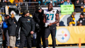 PITTSBURGH, PA - JANUARY 14: Leonard Fournette #27 of the Jacksonville Jaguars walks to the locker room with trainers against the Pittsburgh Steelers during the first half of the AFC Divisional Playoff game at Heinz Field on January 14, 2018 in Pittsburgh, Pennsylvania. (Photo by Kevin C. Cox/Getty Images)