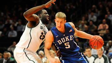 NEW YORK, NY - NOVEMBER 15: Mason Plumlee #5 of the Duke Blue Devils drives the ball against Draymond Green #23 of the Michigan State Spartans during the 2011 State Farm Champions Classic at Madison Square Garden on November 15, 2011 in New York City. (Photo by Patrick McDermott/Getty Images)