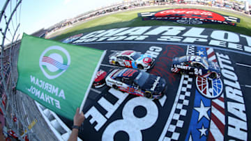 CHARLOTTE, NORTH CAROLINA - MAY 26: William Byron, driver of the #24 Liberty Patriotic Chevrolet, and Aric Almirola, driver of the #10 Smithfield Ford, lead the field to the green flag to start the Monster Energy NASCAR Cup Series Coca-Cola 600 at Charlotte Motor Speedway on May 26, 2019 in Charlotte, North Carolina. (Photo by Brian Lawdermilk/Getty Images)