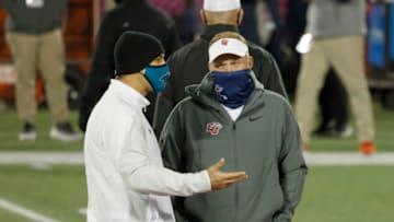 Dec 26, 2020; Orlando, FL, USA; Liberty Flames head coach Hugh Freeze and Coastal Carolina Chanticleers head coach Jamey Chadwell talk at mid field before the game against the Coastal Carolina Chanticleers at Camping World Stadium. Mandatory Credit: Reinhold Matay-USA TODAY Sports
