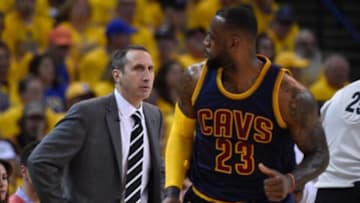 Jun 7, 2015; Oakland, CA, USA; Cleveland Cavaliers head coach David Blatt (left) looks at forward LeBron James (23) during the first quarter in game two of the NBA Finals against the Golden State Warriors at Oracle Arena. The Cavaliers defeated the Warriors 95-93. Mandatory Credit: Kyle Terada-USA TODAY Sports