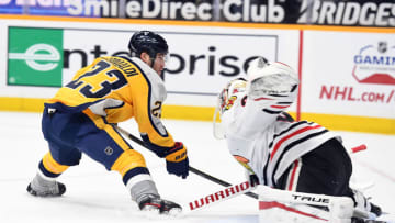 Nashville Predators right wing Rocco Grimaldi (23) has a shot on a breakaway blocked by Chicago Blackhawks goaltender Kevin Lankinen (32) during the first period at Bridgestone Arena. Mandatory Credit: Christopher Hanewinckel-USA TODAY Sports