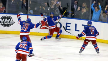 NEW YORK, NY - MAY 25: Martin St. Louis #26 of the New York Rangers celebrates after scoring the game winning shot in overtime against Dustin Tokarski #35 of the Montreal Canadiens to win Game Four of the Eastern Conference Final in the 2014 NHL Stanley Cup Playoffs at Madison Square Garden on May 25, 2014 in New York City. The Rangers defeated the Canadiens 3 to 2. (Photo by Al Bello/Getty Images)