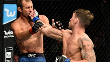 GDANSK, POLAND - OCTOBER 21: (R-L) Darren Till of England punches Donald Cerrone in their welterweight bout during the UFC Fight Night event inside Ergo Arena on October 21, 2017 in Gdansk, Poland. (Photo by Jeff Bottari/Zuffa LLC/Zuffa LLC via Getty Images)