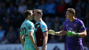 BURNLEY, ENGLAND - MAY 12: Stephan Lichtsteiner of Arsenal clashes with Ashley Barnes of Burnley during the Premier League match between Burnley FC and Arsenal FC at Turf Moor on May 12, 2019 in Burnley, United Kingdom. (Photo by Alex Livesey/Getty Images)