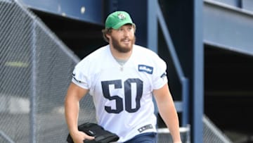 New England Patriots offensive linebacker Cole Strange (50) heads to the practice field for the team's OTA. Mandatory Credit: Eric Canha-USA TODAY Sports