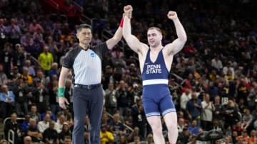 Mar 19, 2022; Detroit, MI, USA; Penn State wrestler Max Dean celebrates after defeating Iowa wrestler Jacob Warner (not pictured) in the 197 pound weight class final match during the NCAA Wrestling Championships at Little Cesars Arena. Mandatory Credit: Raj Mehta-USA TODAY Sports