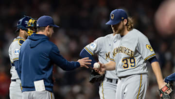 Aug 30, 2021; San Francisco, California, USA; Milwaukee Brewers manager Craig Counsell relieves starting pitcher Corbin Burnes (39) after allowing two San Francisco Giants runners to reach in the seventh inning at Oracle Park. Mandatory Credit: John Hefti-USA TODAY Sports