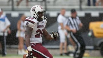 Sep 28, 2013; Orlando, FL, USA; South Carolina Gamecocks running back Mike Davis (28) scores a touchdown during the second half of the game against the UCF Knights at Bright House Networks Stadium. Mandatory Credit: Rob Foldy-USA TODAY Sports