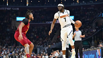 CLEVELAND, OHIO - FEBRUARY 23: Reggie Jackson #7 of the Denver Nuggets drives around Darius Garland #10 of the Cleveland Cavaliers during the second quarter at Rocket Mortgage Fieldhouse on February 23, 2023 in Cleveland, Ohio. NOTE TO USER: User expressly acknowledges and agrees that, by downloading and or using this photograph, User is consenting to the terms and conditions of the Getty Images License Agreement. (Photo by Jason Miller/Getty Images)