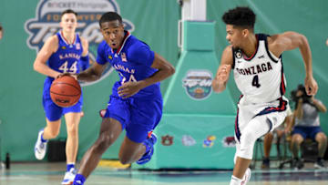 FORT MYERS, FLORIDA - NOVEMBER 26: Bryce Thompson #24 of the Kansas Jayhawks dribbles the ball as Aaron Cook #4 of the Gonzaga Bulldogs defends during the first half during the Rocket Mortgage Fort Myers Tip-Off at Suncoast Credit Union Arena on November 26, 2020 in Fort Myers, Florida. (Photo by Douglas P. DeFelice/Getty Images)