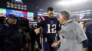 FOXBOROUGH, MASSACHUSETTS - OCTOBER 27: Tom Brady #12 of the New England Patriots congratulates head coach Bill Belichick on his 300th win after the game against the Cleveland Browns at Gillette Stadium on October 27, 2019 in Foxborough, Massachusetts. (Photo by Omar Rawlings/Getty Images)
