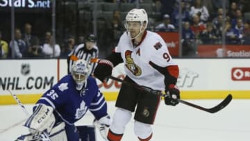 Sep 24, 2014; Toronto, Ontario, CAN; Ottawa Senators forward Milan Michalek (9) skates by Toronto Maple Leafs goaltender Christoppher Gibson (35) after scoring the winning goal in the shoot-out at the Air Canada Centre. Ottawa defeated Toronto 4-3 in an overtime shoot-out. Mandatory Credit: John E. Sokolowski-USA TODAY Sports