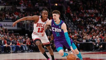 Apr 8, 2022; Chicago, Illinois, USA; Charlotte Hornets guard LaMelo Ball (2) drives to the basket against Chicago Bulls guard Ayo Dosunmu (12) during the second half at United Center. Mandatory Credit: Kamil Krzaczynski-USA TODAY Sports