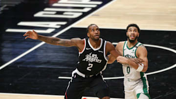 LOS ANGELES, CALIFORNIA - FEBRUARY 05: Kawhi Leonard #2 of the LA Clippers watches for a pass defended by Jayson Tatum #0 of the Boston Celtics at Staples Center on February 05, 2021 in Los Angeles, California. NOTE TO USER: User expressly acknowledges and agrees that, by downloading and or using this photograph, User is consenting to the terms and conditions of the Getty Images License Agreement. (Photo by Meg Oliphant/Getty Images)