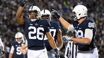 Nov 26, 2016; University Park, PA, USA; Penn State Nittany Lions running back Saquon Barkley (26) reacts following his touchdown run with teammate tight end Mike Gesicki (88) against the Michigan State Spartans during the second quarter at Beaver Stadium. Mandatory Credit: Rich Barnes-USA TODAY Sports