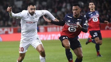 Lille's Brazilian defender Gabriel dos Santos Magalhaes (R) fights for the ball with Montpellier's French forward Gaetan Laborde during the French L1 football match between Lille OSC (LOSC) and Montpellier Herault Sport Club (MHSC) at the Pierre Mauroy Stadium in Villeneuve-d'Ascq, on December 13, 2019. (Photo by FRANCOIS LO PRESTI / AFP) (Photo by FRANCOIS LO PRESTI/AFP via Getty Images)
