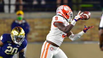 Nov 7, 2020; South Bend, Indiana, USA; Clemson Tigers running back Travis Etienne (9) drops a pass as Notre Dame Fighting Irish safety Shaun Crawford (20) defends in the second quarter at Notre Dame Stadium. Mandatory Credit: Matt Cashore-USA TODAY Sports