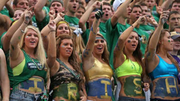 SOUTH BEND, IN - AUGUST 31: Student fans of the Notre Dame Fighting Irish cheer for their team against the Temple Owls at Notre Dame Stadium on August 31, 2013 in South Bend, Indiana. (Photo by Jonathan Daniel/Getty Images)