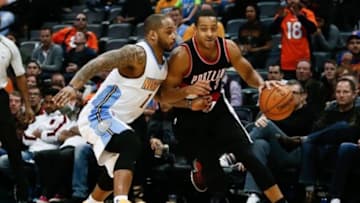 Jan 3, 2016; Denver, CO, USA; Denver Nuggets guard Jameer Nelson (1) guards Portland Trail Blazers guard C.J. McCollum (3) in the fourth quarter at the Pepsi Center. The Trail Blazers defeated the Nuggets 112-106. Mandatory Credit: Isaiah J. Downing-USA TODAY Sports