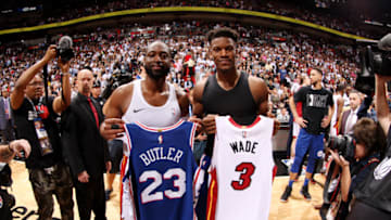MIAMI, FL - APRIL 9: Dwyane Wade #3 of the Miami Heat and Jimmy Butler #23 of the Philadelphia 76ers exchange jerseys following the game on April 9, 2019 at American Airlines Arena in Miami, Florida. NOTE TO USER: User expressly acknowledges and agrees that, by downloading and or using this Photograph, user is consenting to the terms and conditions of the Getty Images License Agreement. Mandatory Copyright Notice: Copyright 2019 NBAE (Photo by Issac Baldizon/NBAE via Getty Images)