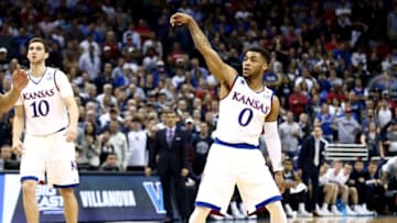 Mar 26, 2016; Louisville, KY, USA; Kansas Jayhawks guard Frank Mason III (0) reacts after making a three pointer during the second half against the Villanova Wildcats in the south regional final of the NCAA Tournament at KFC YUM!. Mandatory Credit: Aaron Doster-USA TODAY Sports