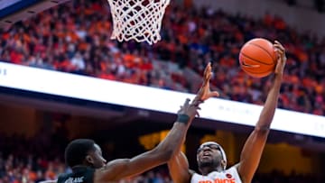 SYRACUSE, NY - DECEMBER 08: Paschal Chukwu #13 of the Syracuse Orange shoots the ball against Josh LeBlanc #23 of the Georgetown Hoyas during the second half at the Carrier Dome on December 8, 2018 in Syracuse, New York. Syracuse defeated Georgetown 72-71. (Photo by Brett Carlsen/Getty Images)