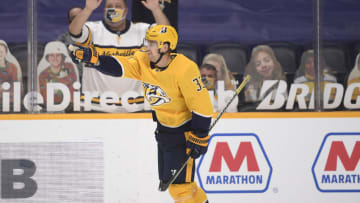 Apr 13, 2021; Nashville, Tennessee, USA; Nashville Predators right wing Viktor Arvidsson (33) points to Nashville Predators defenseman Roman Josi (59) for the assist against the Tampa Bay Lightning during the third period at Bridgestone Arena. Mandatory Credit: Steve Roberts-USA TODAY Sports