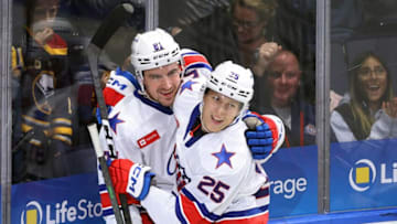 Amerks Brett Murray is congratulated by teammate Jiri Kulich (25) after Murray's goal.