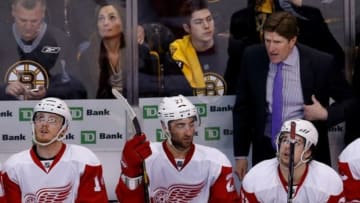 Apr 26, 2014; Boston, MA, USA; Detroit Red Wings head coach Mike Babcock (R) reacts from behind the bench during the third period against the Boston Bruins in game five of the first round of the 2014 Stanley Cup Playoffs at TD Banknorth Garden. The Bruins won 4-2. Mandatory Credit: Greg M. Cooper-USA TODAY Sports