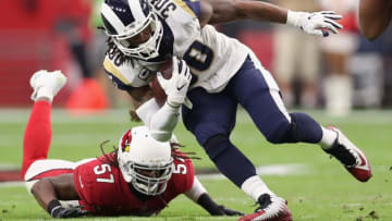 GLENDALE, AZ - DECEMBER 03: Running back Todd Gurley #30 of the Los Angeles Rams rushes the football past linebacker Josh Bynes #57 of the Arizona Cardinals during the NFL game at the University of Phoenix Stadium on December 3, 2017 in Glendale, Arizona. The Rams defeated the Cardinals 32-16. (Photo by Christian Petersen/Getty Images)
