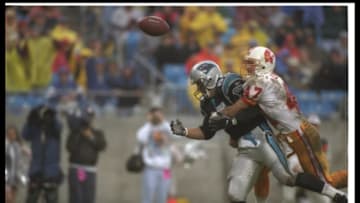 1 Dec 1996: Defensive back John Lynch of the Tampa Bay Buccaneers (right) breaks up a pass intended for Carolina Panthers tight end Wesley Walls during a game at Ericsson Stadium in Charlotte, North Carolina. The Panthers won the game, 24-0. Mandatory C