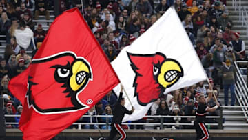 Nov 5, 2016; Boston, MA, USA; The Louisville Cardinals cheerleaders run with flags after a touchdown against the Boston College Eagles during the second quarter at Alumni Stadium. Mandatory Credit: Greg M. Cooper-USA TODAY Sports