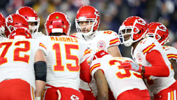 FOXBOROUGH, MASSACHUSETTS - DECEMBER 08: Patrick Mahomes #15 of the Kansas City Chiefs talks to Travis Kelce #87 and teammates in the huddle during the game against the New England Patriots at Gillette Stadium on December 08, 2019 in Foxborough, Massachusetts. (Photo by Maddie Meyer/Getty Images)