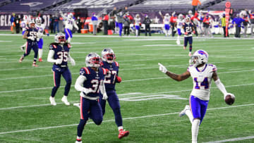 FOXBOROUGH, MASSACHUSETTS - DECEMBER 28: Stefon Diggs #14 of the Buffalo Bills reacts as he runs into the end zone for a touchdown as Jonathan Jones #31 and J.C. Jackson #27 of the New England Patriots give chase during the first half at Gillette Stadium on December 28, 2020 in Foxborough, Massachusetts. (Photo by Billie Weiss/Getty Images)