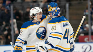 Mar 2, 2022; Toronto, Ontario, CAN; Buffalo Sabres goaltender Craig Anderson (41) celebrates the win with center Peyton Krebs (19) against the Toronto Maple Leafs at Scotiabank Arena. Mandatory Credit: Nick Turchiaro-USA TODAY Sports