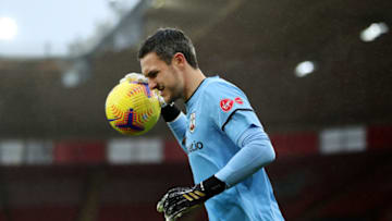 SOUTHAMPTON, ENGLAND - DECEMBER 13: Alex McCarthy of Southampton collects the ball during the Premier League match between Southampton and Sheffield United at St Mary's Stadium on December 13, 2020 in Southampton, England. A limited number of spectators (2000) are welcomed back to stadiums to watch elite football across England. This was following easing of restrictions on spectators in tiers one and two areas only. (Photo by Naomi Baker/Getty Images)