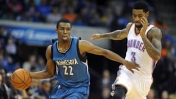 Oct 19, 2014; Tulsa, OK, USA; Minnesota Timberwolves guard Andrew Wiggins (22) handles the ball against Oklahoma City Thunder forward Perry Jones (3) during the fourth quarter at BOK Center. Mandatory Credit: Mark D. Smith-USA TODAY Sports