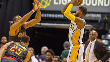 Nov 23, 2016; Indianapolis, IN, USA; Indiana Pacers forward Paul George (13) shoots the ball while Atlanta Hawks center Dwight Howard (8) defends in the second half of the game at Bankers Life Fieldhouse. The Atlanta Hawks beat the Indiana Pacers 96-85. Mandatory Credit: Trevor Ruszkowski-USA TODAY Sports