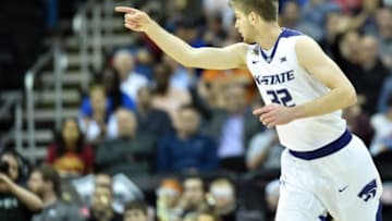Mar 9, 2016; Kansas City, MO, USA; Kansas State Wildcats forward Dean Wade (32) celebrates after scoring in the first half against the Oklahoma State Cowboys during the Big 12 Conference tournament at Sprint Center. Mandatory Credit: Denny Medley-USA TODAY Sports