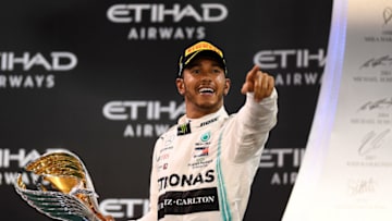ABU DHABI, UNITED ARAB EMIRATES - DECEMBER 01: Race winner Lewis Hamilton of Great Britain and Mercedes GP celebrates on the podium during the F1 Grand Prix of Abu Dhabi at Yas Marina Circuit on December 01, 2019 in Abu Dhabi, United Arab Emirates. (Photo by Clive Mason/Getty Images)