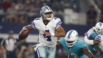 Aug 19, 2016; Arlington, TX, USA; Dallas Cowboys quarterback Dak Prescott (4) rolls out to pass in the third quarter against Miami Dolphins defensive end Julius Warmsley (73) at AT&T Stadium. Dallas won 41-14. Mandatory Credit: Tim Heitman-USA TODAY Sports